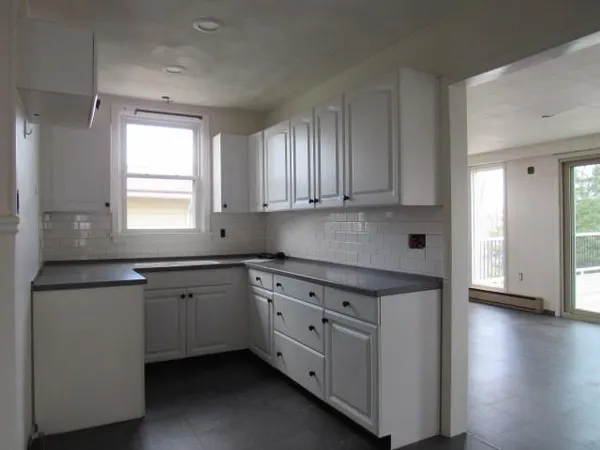 a bathroom with a toilet a sink and bathtub