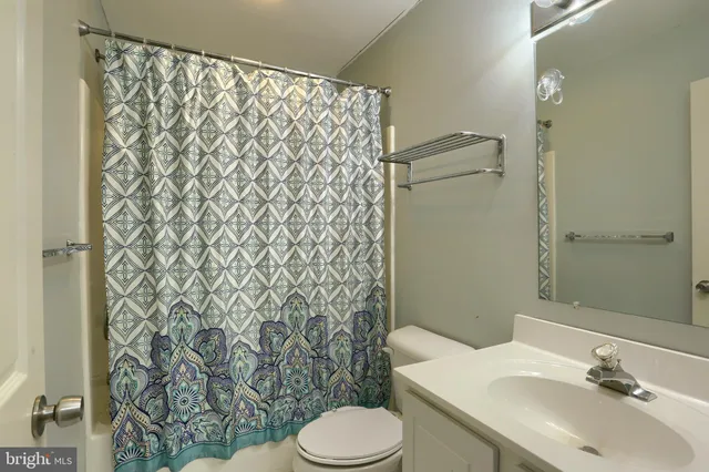 a bathroom with a sink and toilet