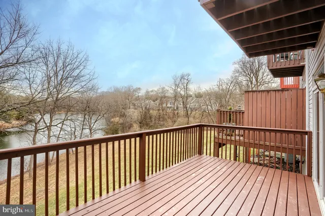 a view of balcony with wooden floor