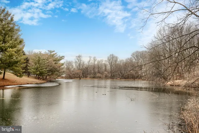 a view of residential house with outdoor space and lake view