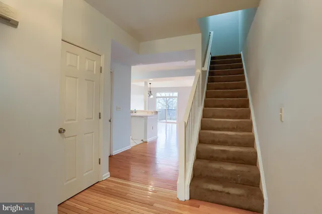 a view of an entryway with wooden floor