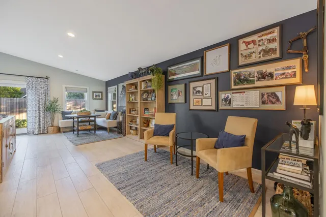 a spacious bathroom with a double vanity sink a mirror and a shower