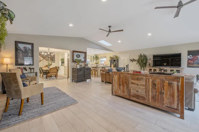 a spacious bathroom with a sink a vanity and a mirror