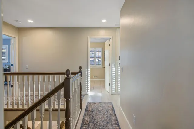 an aerial view of multiple houses with yard
