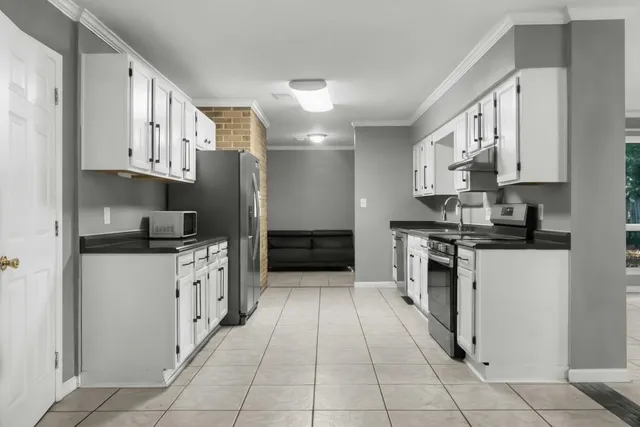 a view of a kitchen with microwave and stove