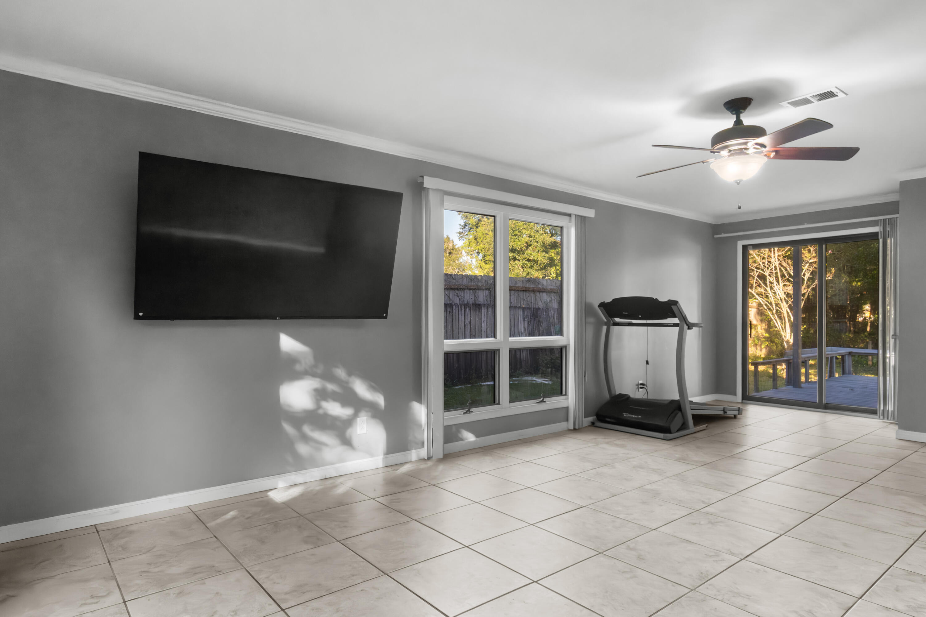 512 Lang Road Fort Walton Beach, FL 32547 - Photo 16 of 51 a living room with furniture a flat screen tv and a fireplace