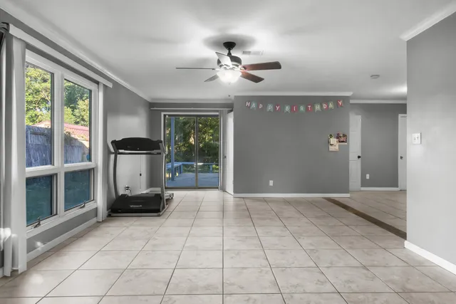 an empty room with windows and way to room