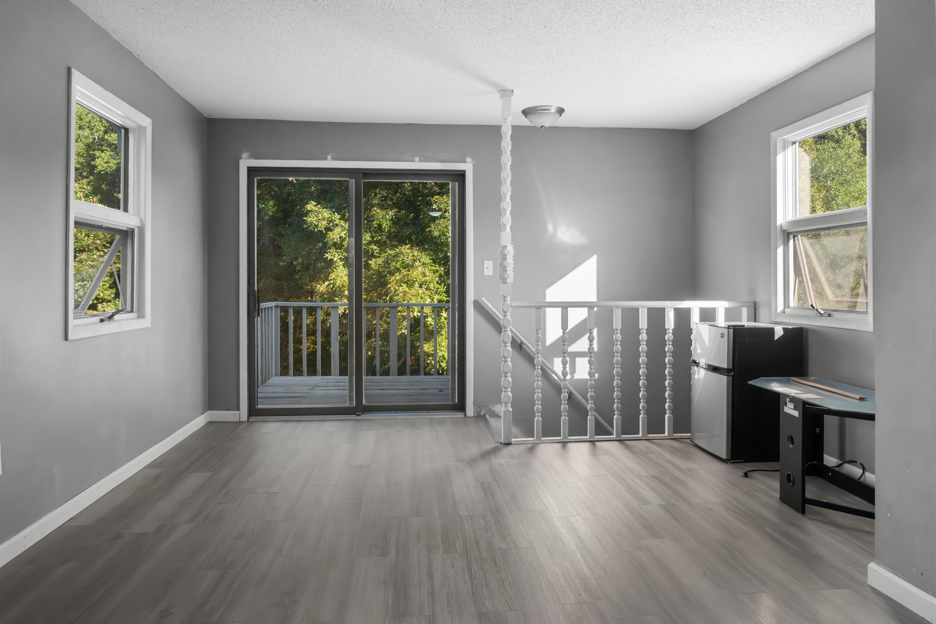 512 Lang Road Fort Walton Beach, FL 32547 - Photo 24 of 51 a view of an empty room with wooden floor and a window