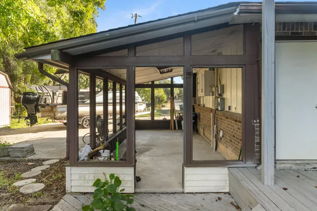 a view of a chairs and table in a balcony