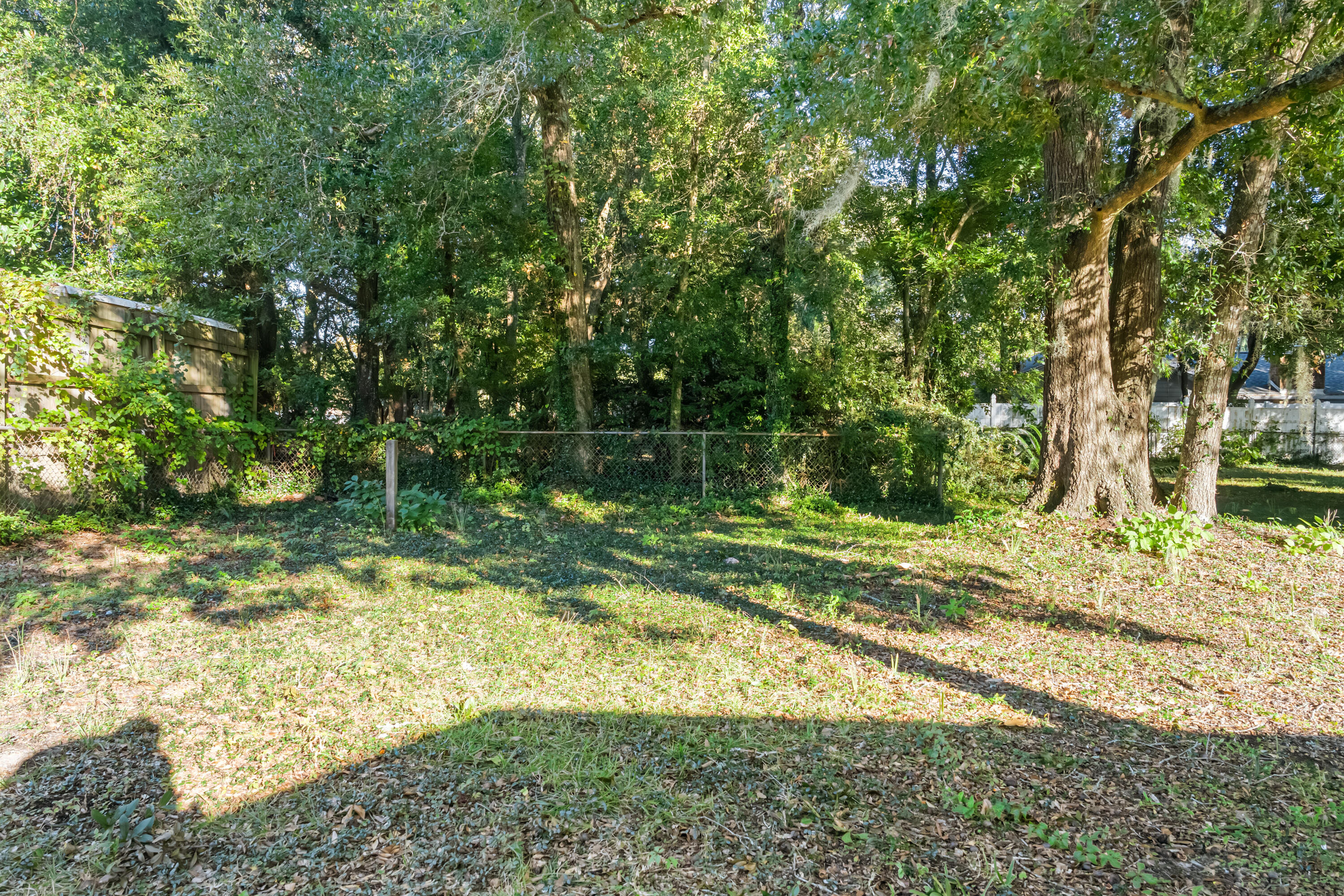 512 Lang Road Fort Walton Beach, FL 32547 - Photo 36 of 51 a view of a yard with large trees