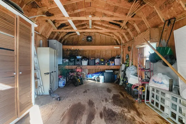 a view of a backyard with a garden and trees