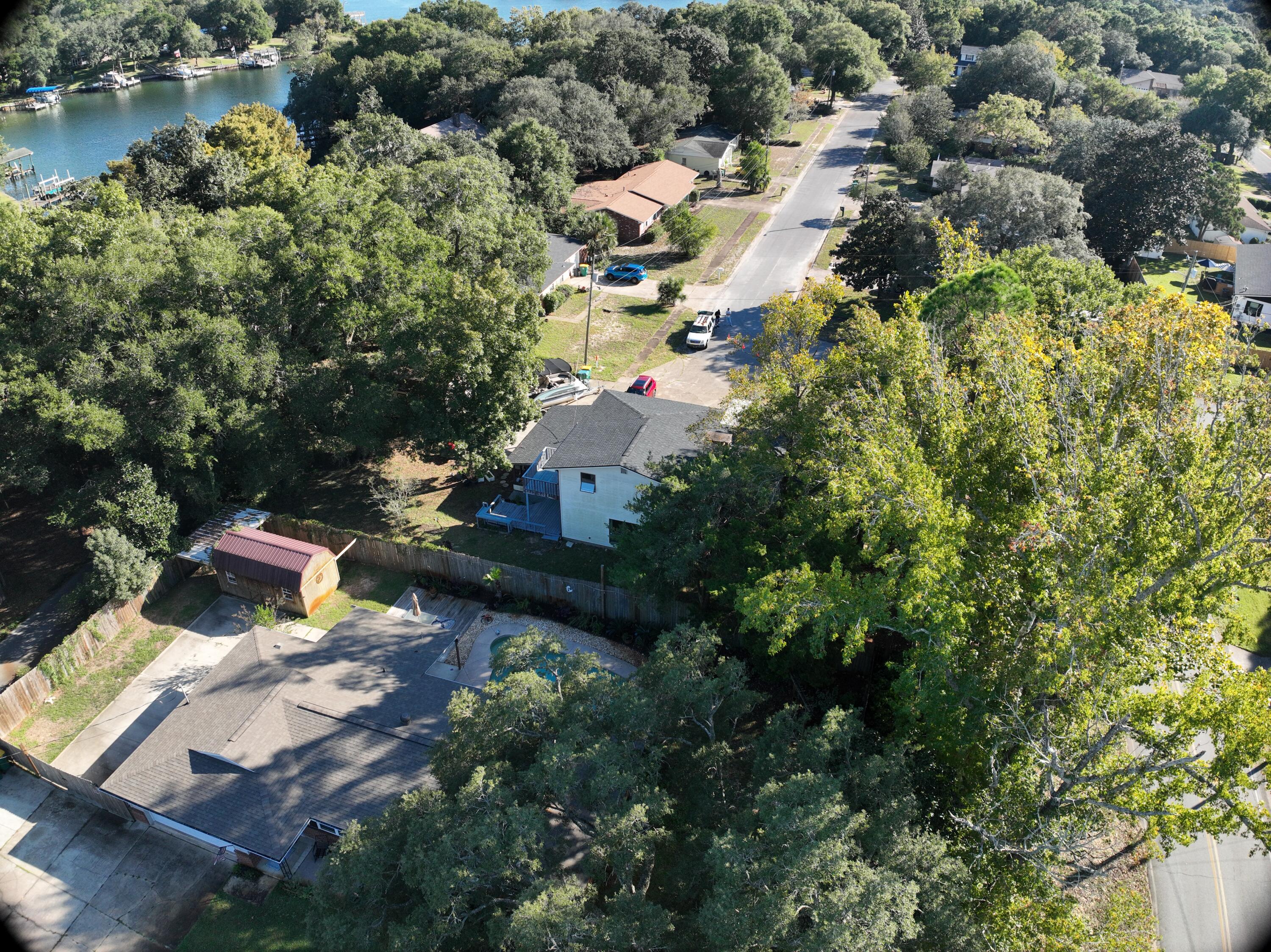 512 Lang Road Fort Walton Beach, FL 32547 - Photo 42 of 51 an aerial view of a house with a yard