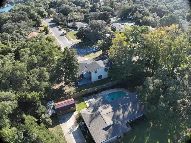 an aerial view of residential houses with outdoor space