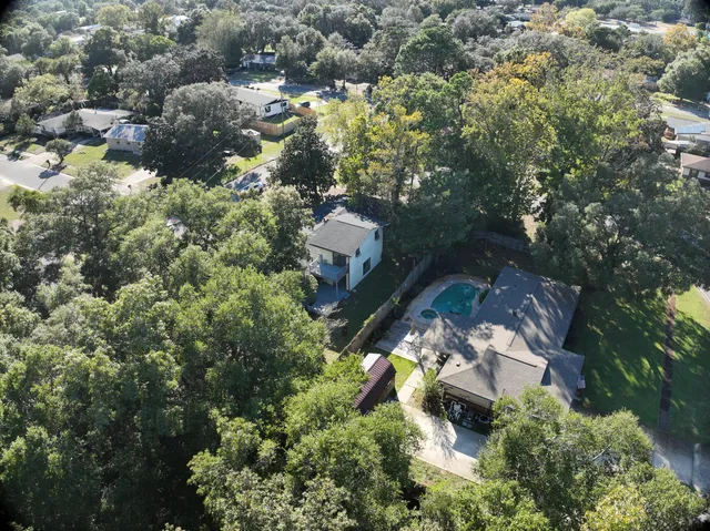 an aerial view of residential houses with outdoor space