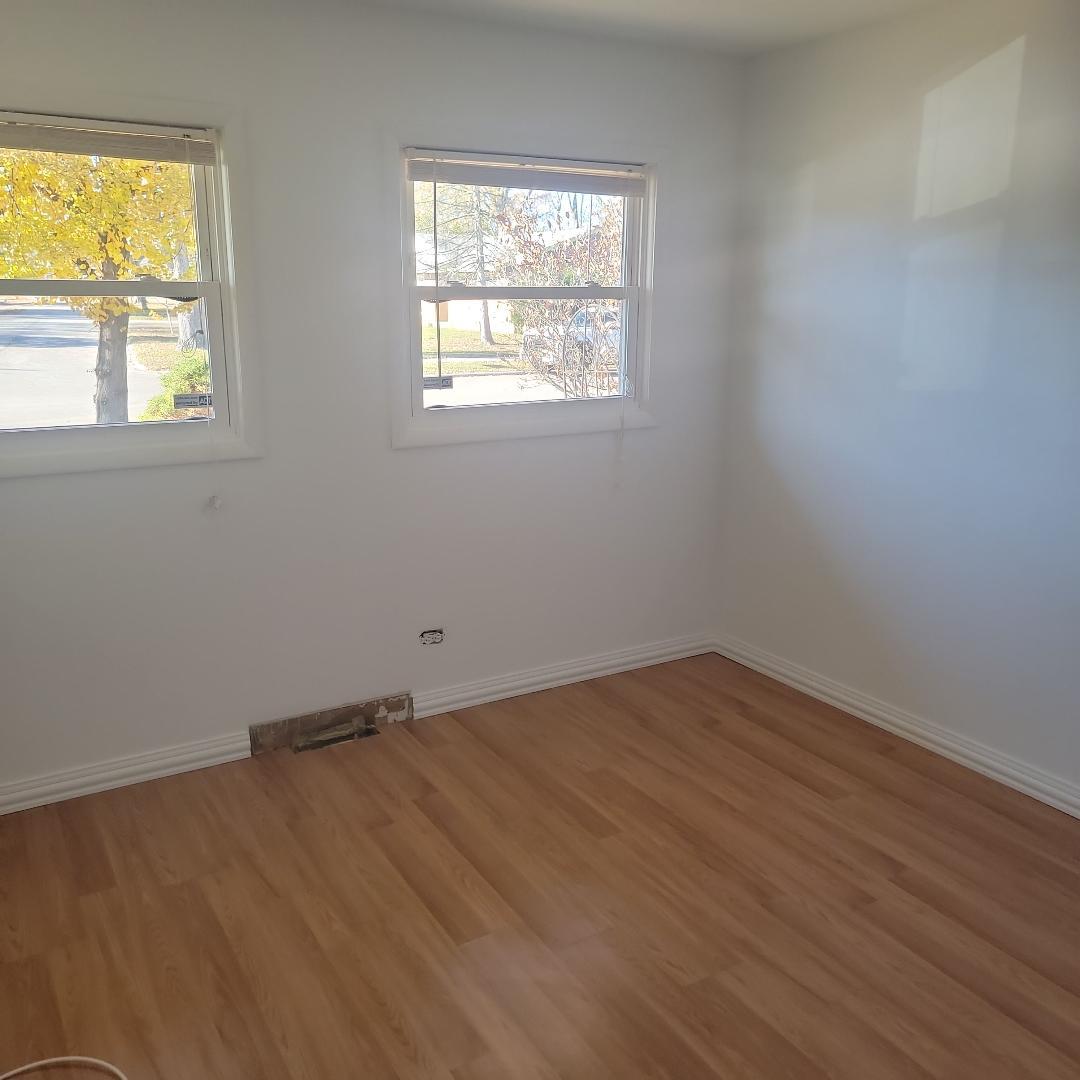 7 Wildwood Road Elk Grove Village, IL 60007 - Photo 7 of 7 an empty room with a window