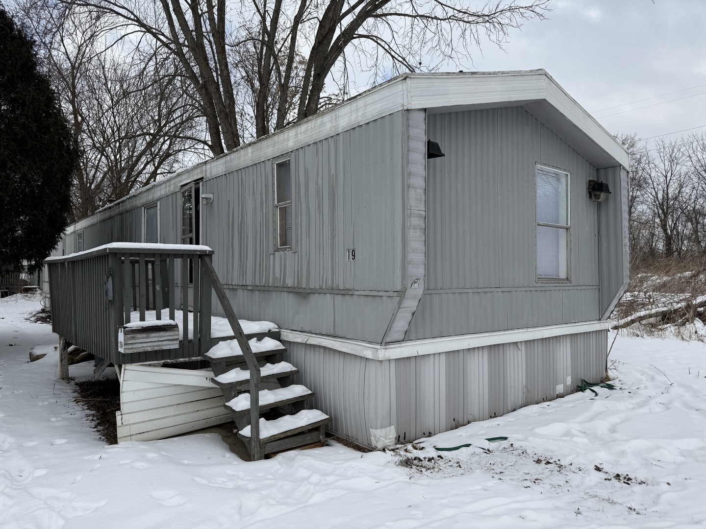 1712 South Dixie Highway, Unit 19 Crete, IL 60417 - Photo 1 of 12 a view of wooden deck