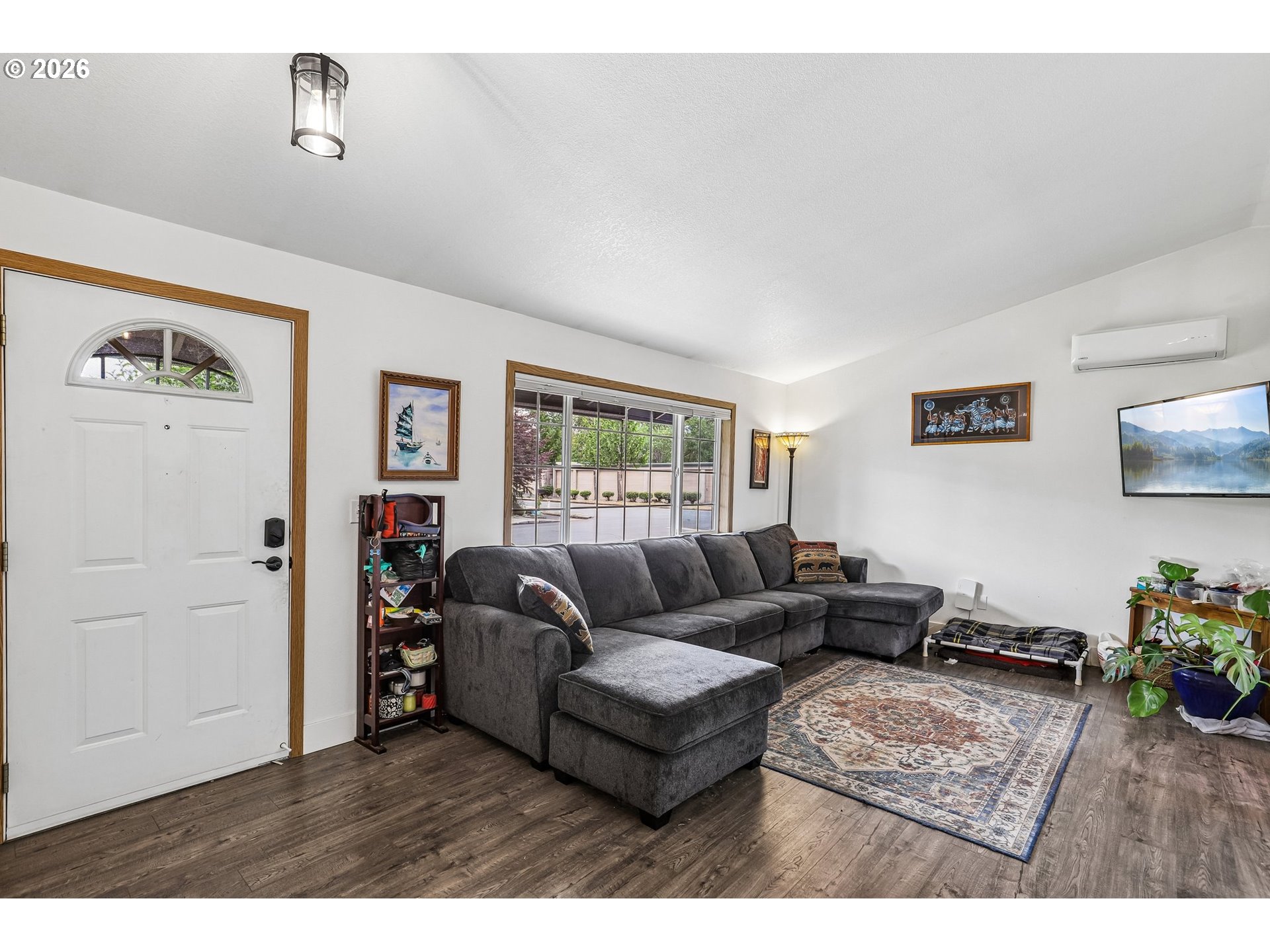 608 Southeast Sumner Street Camas, WA 98607 - Photo 5 of 39 a living room with furniture and a rug
