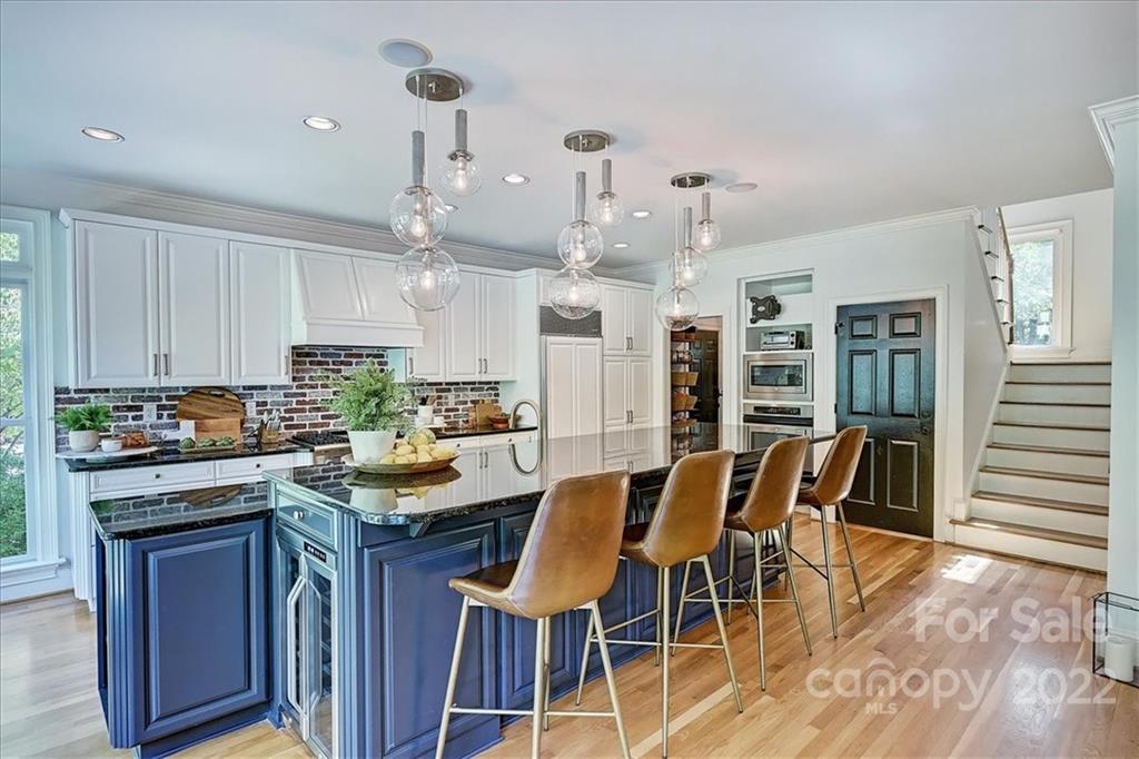 18600 Hammock Lane Davidson, NC 28036 - Photo 13 of 48 a view of a dining room with furniture and wooden floor