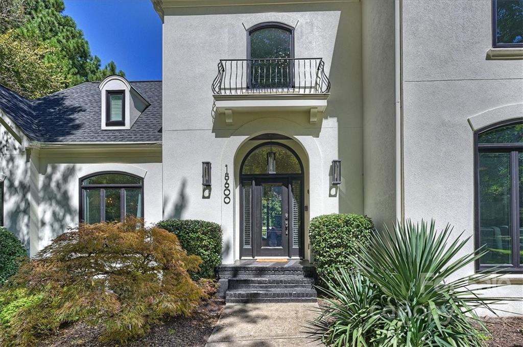 18600 Hammock Lane Davidson, NC 28036 - Photo 2 of 48 a front view of a house with garden