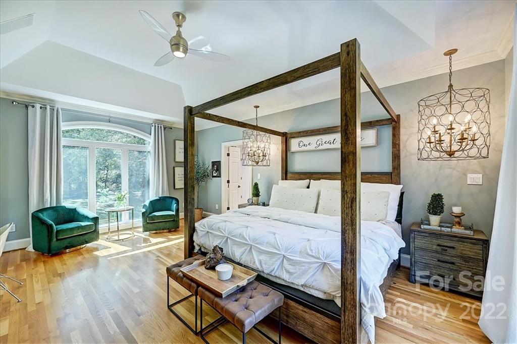 18600 Hammock Lane Davidson, NC 28036 - Photo 22 of 48 a bedroom with a bed and wooden floor