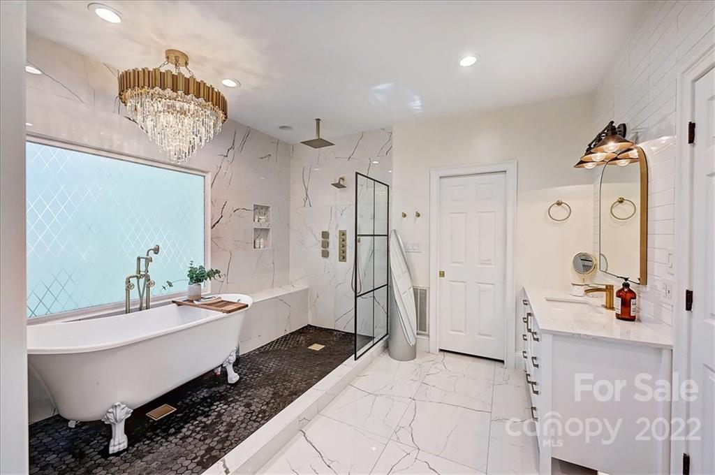 18600 Hammock Lane Davidson, NC 28036 - Photo 25 of 48 a spacious bathroom with a double vanity sink a mirror and a shower