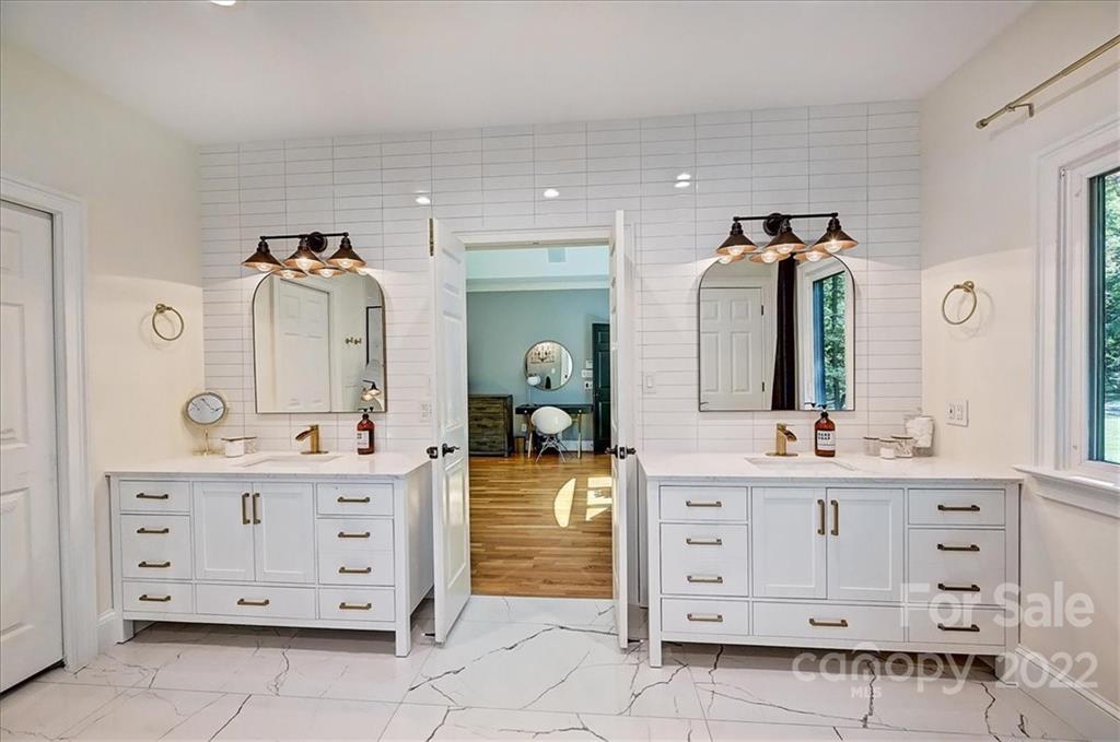 18600 Hammock Lane Davidson, NC 28036 - Photo 26 of 48 a spacious bathroom with a double vanity sink and a mirror