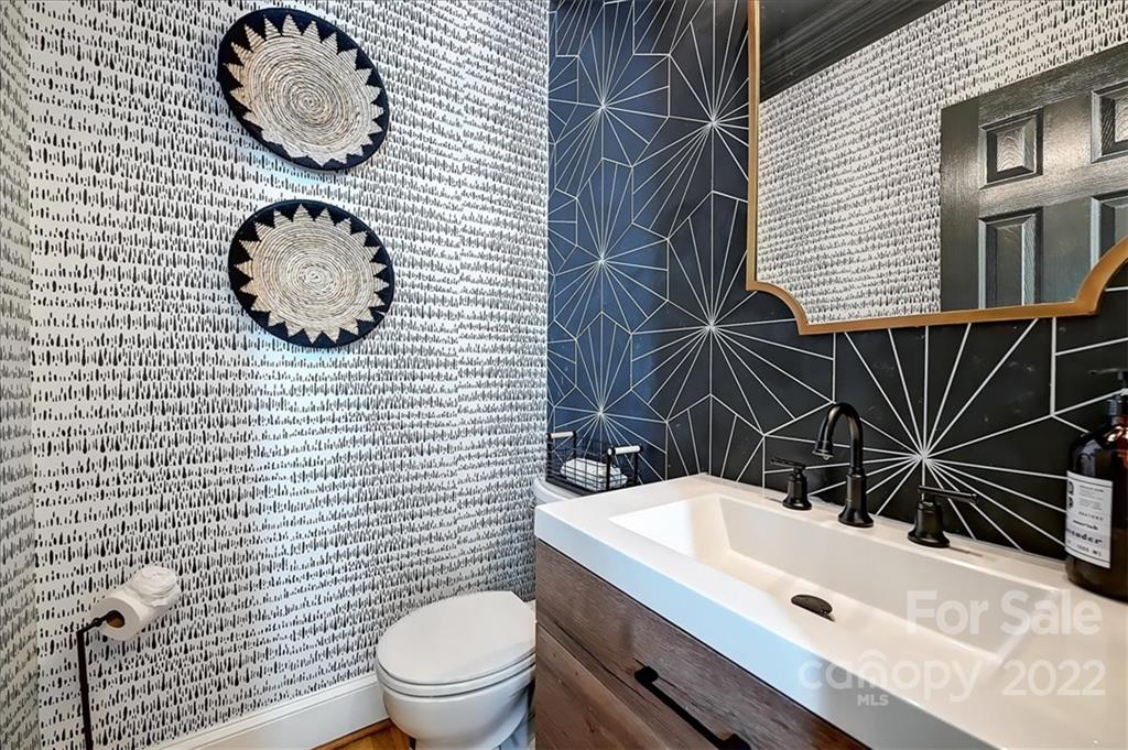 18600 Hammock Lane Davidson, NC 28036 - Photo 27 of 48 a bathroom with a sink a toilet and shower