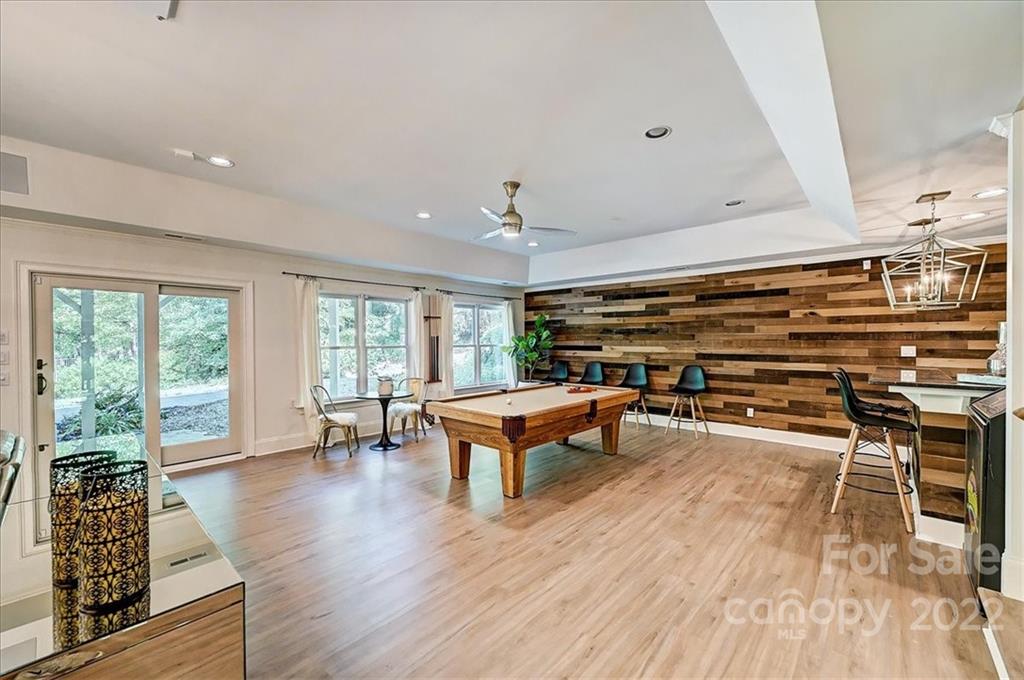 18600 Hammock Lane Davidson, NC 28036 - Photo 34 of 48 a living room with furniture a wooden floor and a window