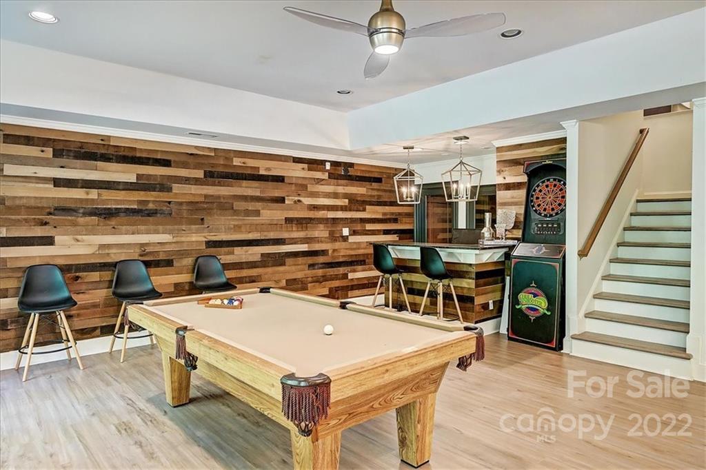 18600 Hammock Lane Davidson, NC 28036 - Photo 35 of 48 a room with furniture and wooden floor