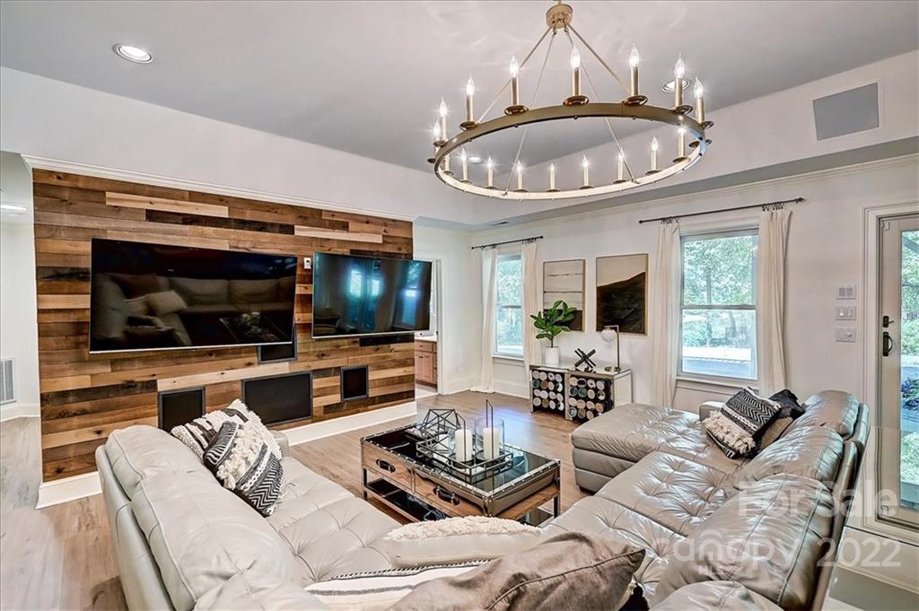 18600 Hammock Lane Davidson, NC 28036 - Photo 38 of 48 a living room with furniture and a flat screen tv