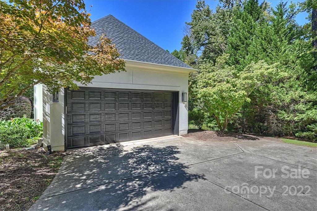 18600 Hammock Lane Davidson, NC 28036 - Photo 4 of 48 a front view of a house with a yard and garage
