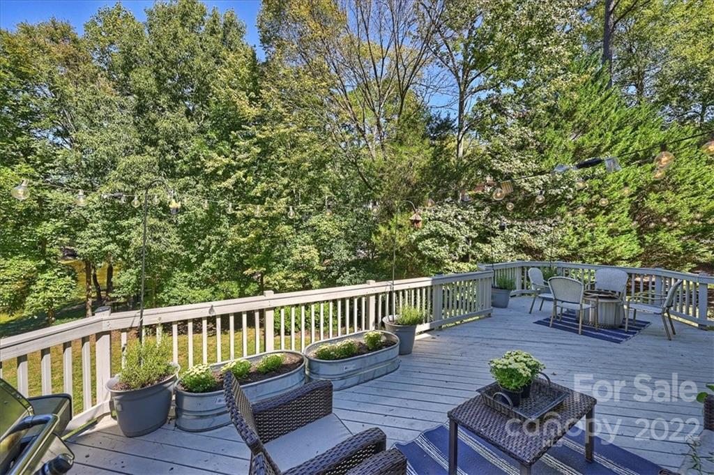 18600 Hammock Lane Davidson, NC 28036 - Photo 45 of 48 a view of a chair and table on the wooden deck