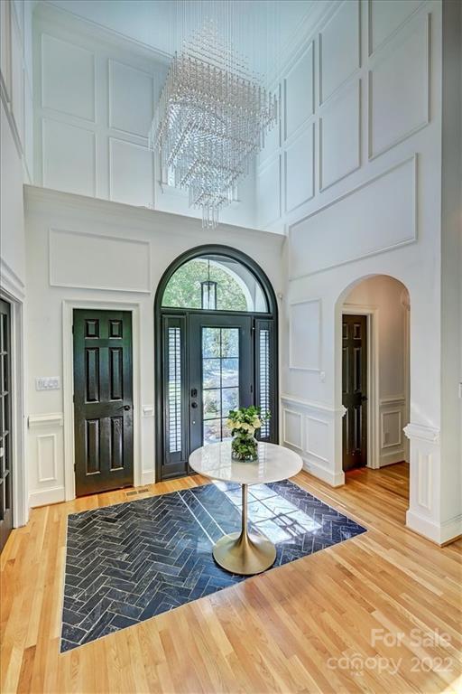 18600 Hammock Lane Davidson, NC 28036 - Photo 7 of 48 a view of a hallway with entryway wooden floor and cabinet
