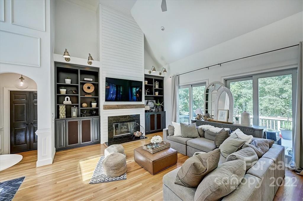 18600 Hammock Lane Davidson, NC 28036 - Photo 8 of 48 a living room with furniture large window and a fireplace