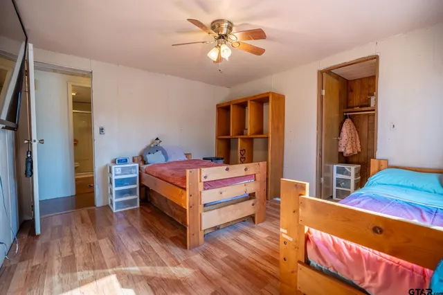 a bed room with a bed and a chandelier