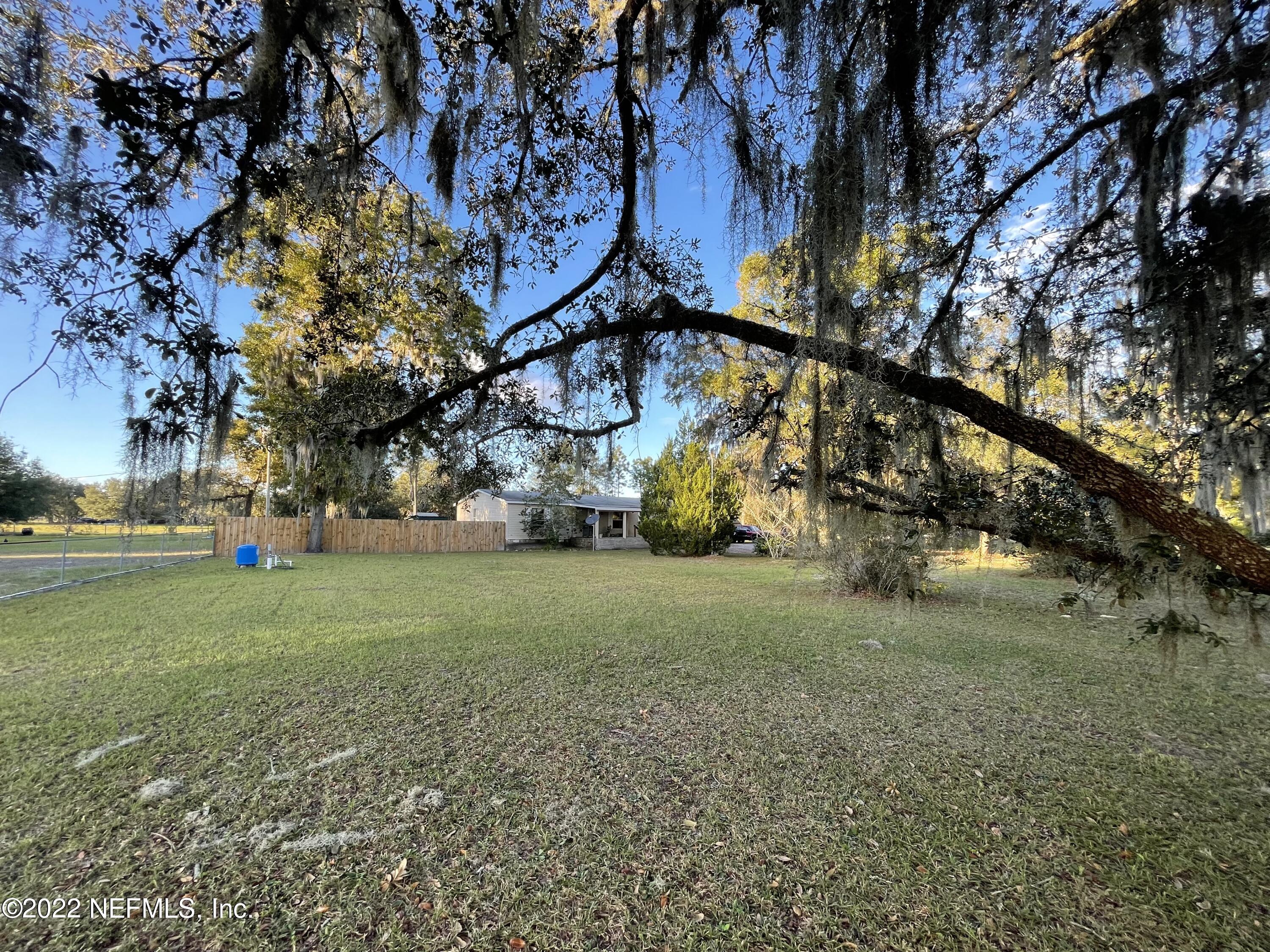 116 Comer Road Palatka, FL 32177 - Photo 16 of 51 a view of a field with large trees