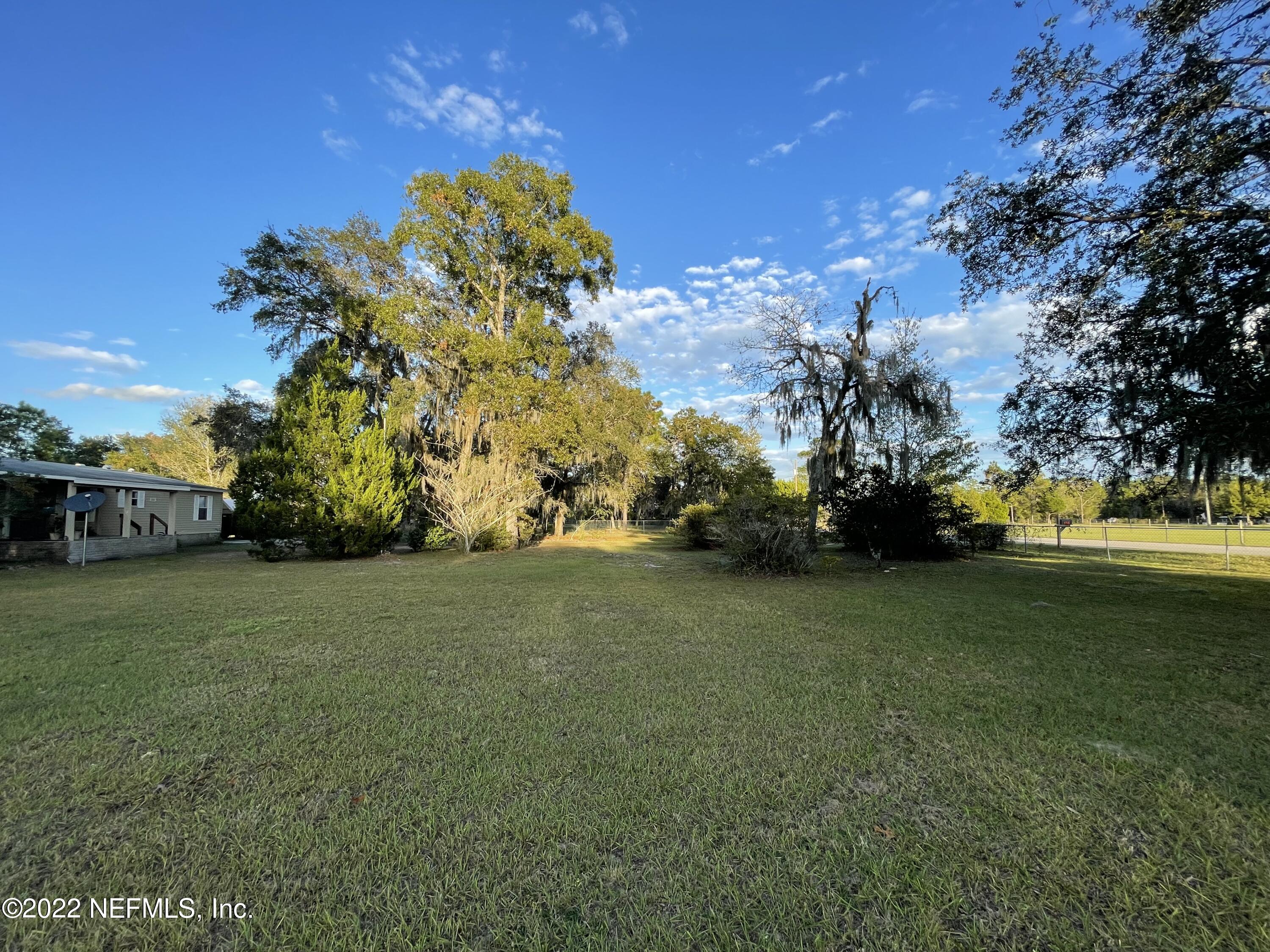 116 Comer Road Palatka, FL 32177 - Photo 19 of 51 a view of a field of grass and trees