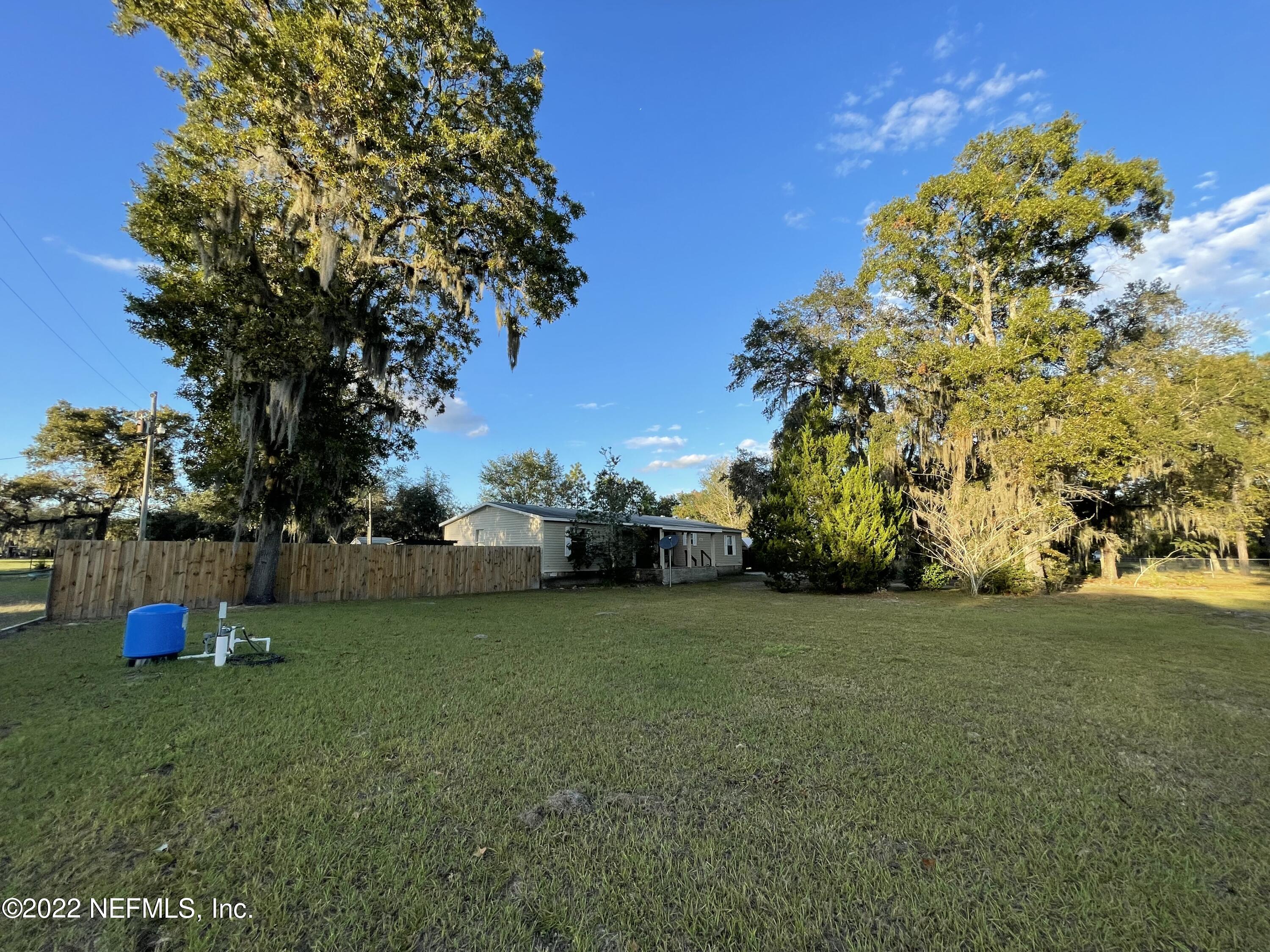 116 Comer Road Palatka, FL 32177 - Photo 20 of 51 a view of a field of grass and trees