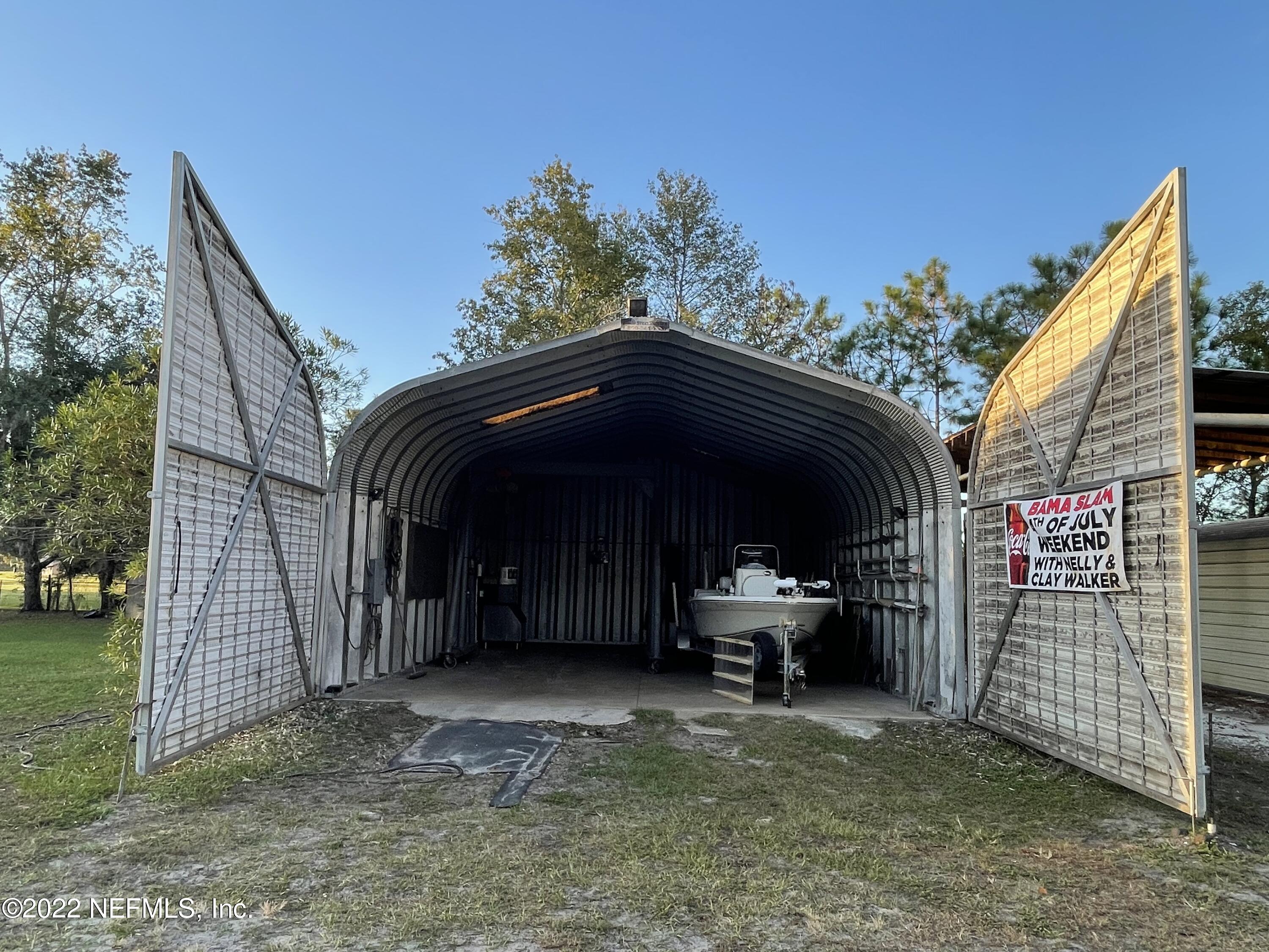 116 Comer Road Palatka, FL 32177 - Photo 29 of 51 a view of backyard with barbeque grill and seating area