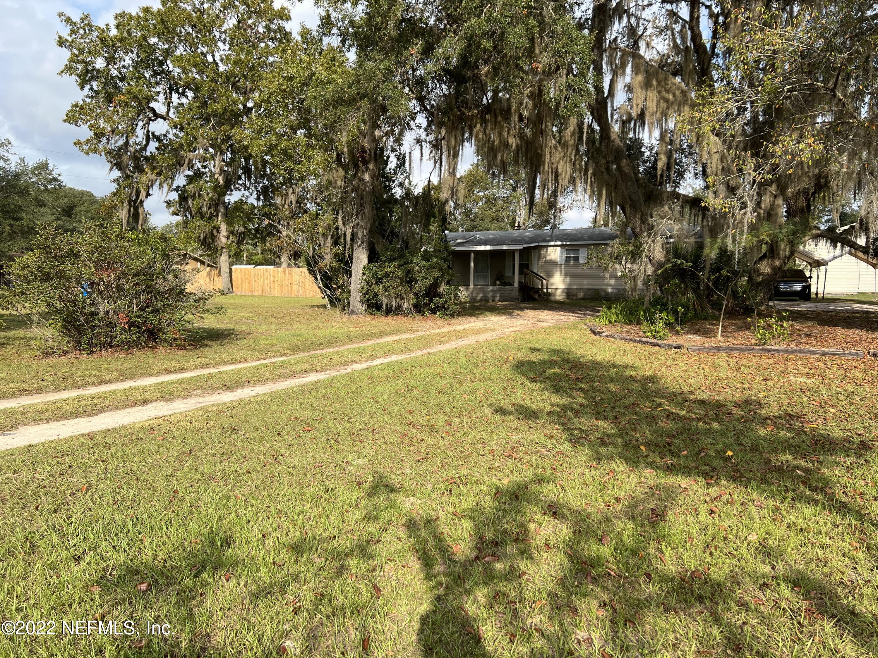 116 Comer Road Palatka, FL 32177 - Photo 3 of 51 a view of swimming pool next to a yard with large trees