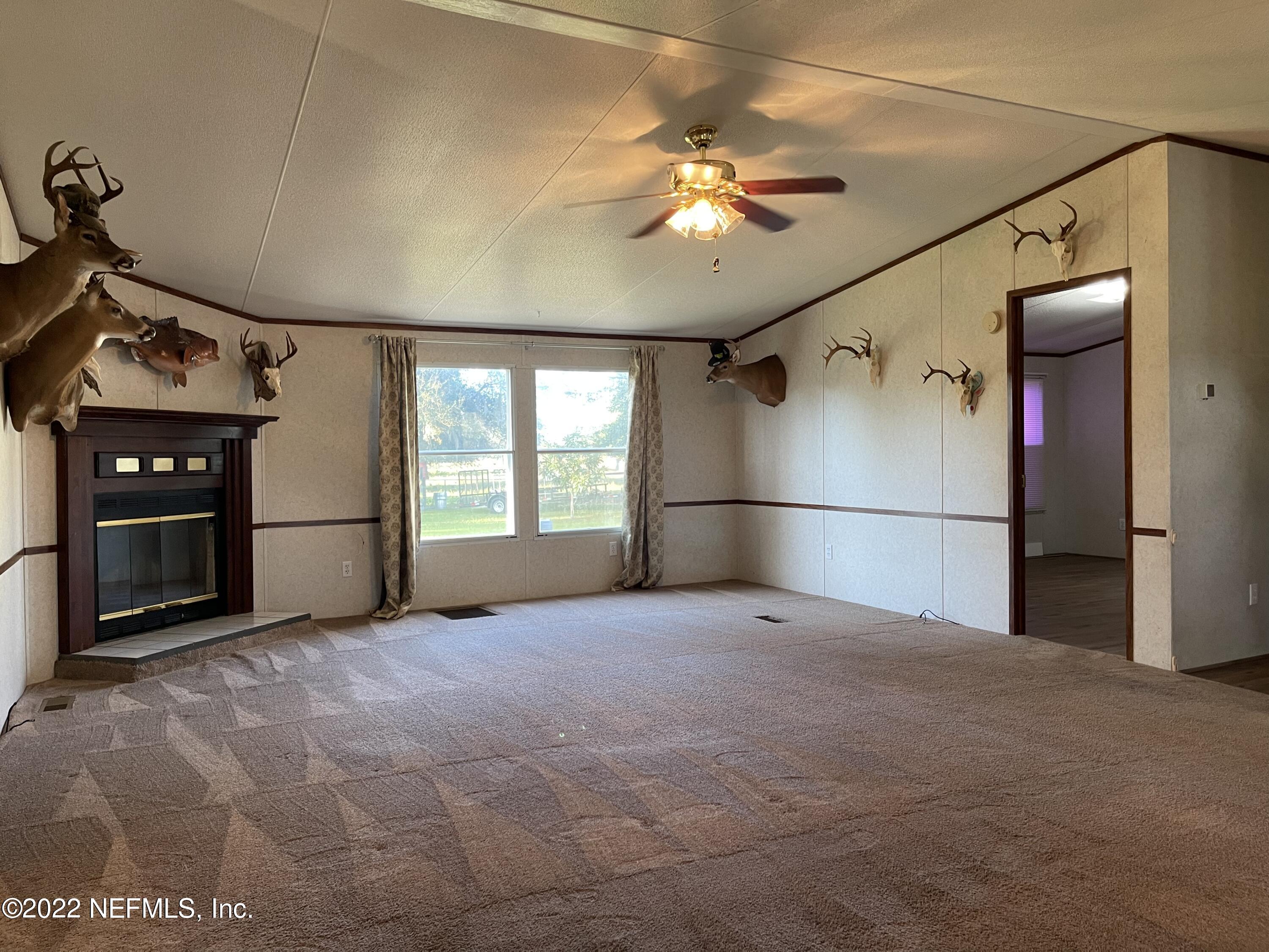 116 Comer Road Palatka, FL 32177 - Photo 50 of 51 a view of empty room with a ceiling fan