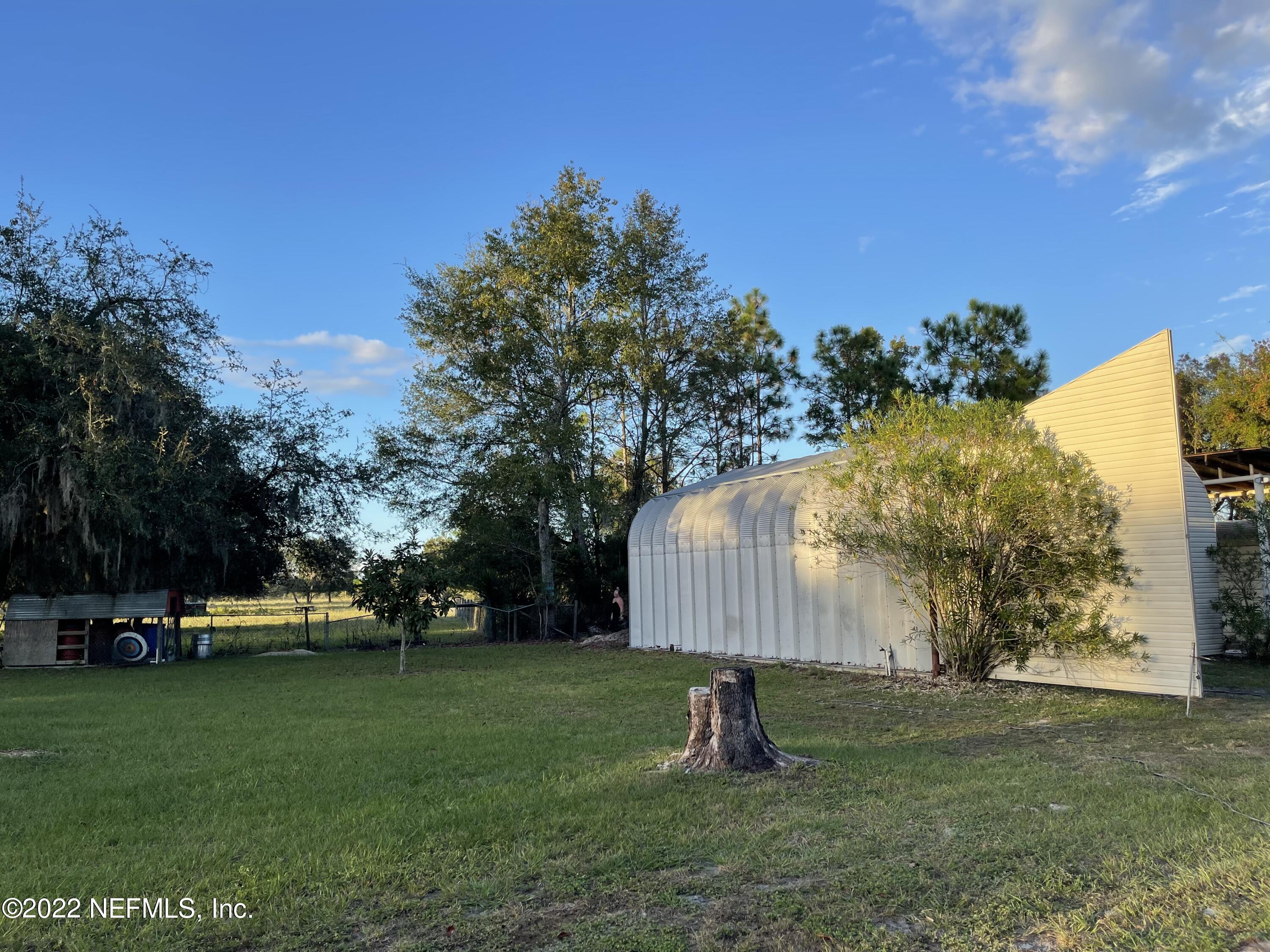 116 Comer Road Palatka, FL 32177 - Photo 10 of 51 a view of a park with swings and a slide