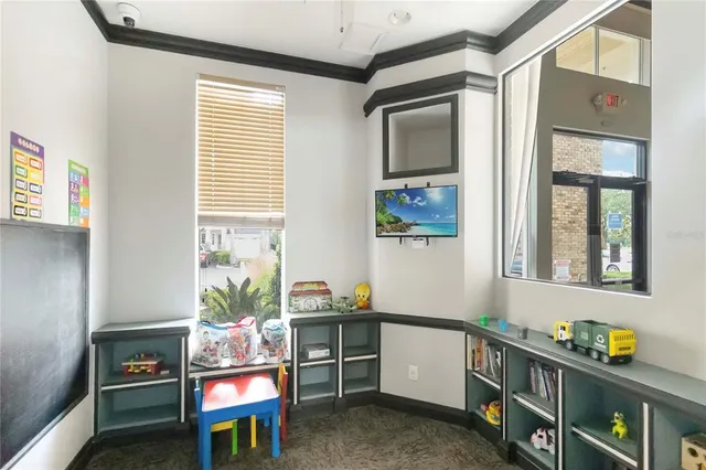 a room with furniture a rug and a window