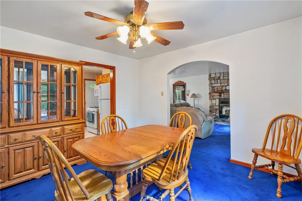 1031 Anderson Road Pittsburgh, PA 15209 - Photo 11 of 35 a dining room with furniture a chandelier and wooden floor