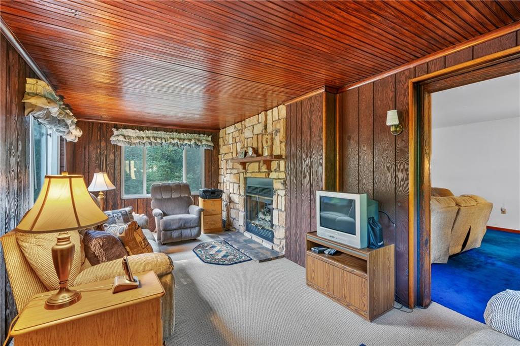 1031 Anderson Road Pittsburgh, PA 15209 - Photo 13 of 35 a living room with furniture and a flat screen tv