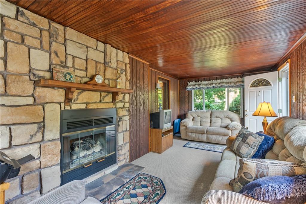 1031 Anderson Road Pittsburgh, PA 15209 - Photo 14 of 35 a living room with furniture and a fireplace