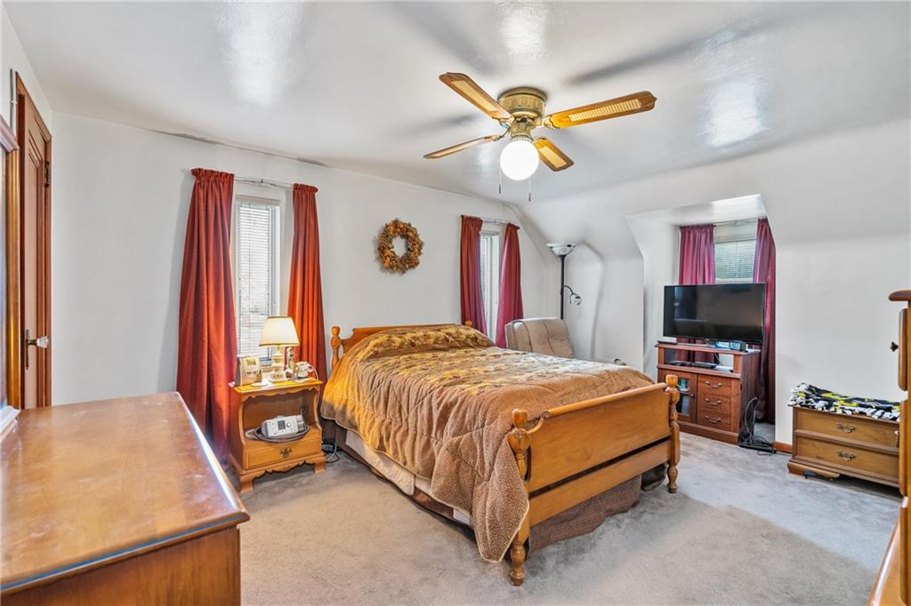 1031 Anderson Road Pittsburgh, PA 15209 - Photo 15 of 35 a bed room with a bed and a television