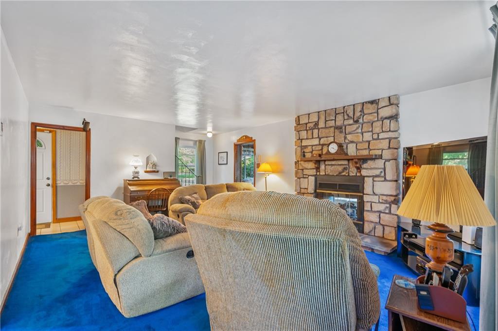 1031 Anderson Road Pittsburgh, PA 15209 - Photo 16 of 35 a living room with furniture and a lamp
