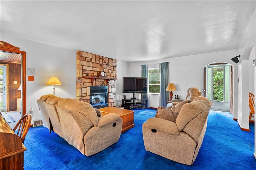 1031 Anderson Road Pittsburgh, PA 15209 - Photo 18 of 35 a living room with fireplace furniture and a wooden floor