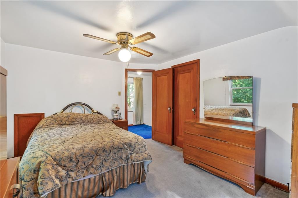 1031 Anderson Road Pittsburgh, PA 15209 - Photo 22 of 35 a bedroom with a bed and a window